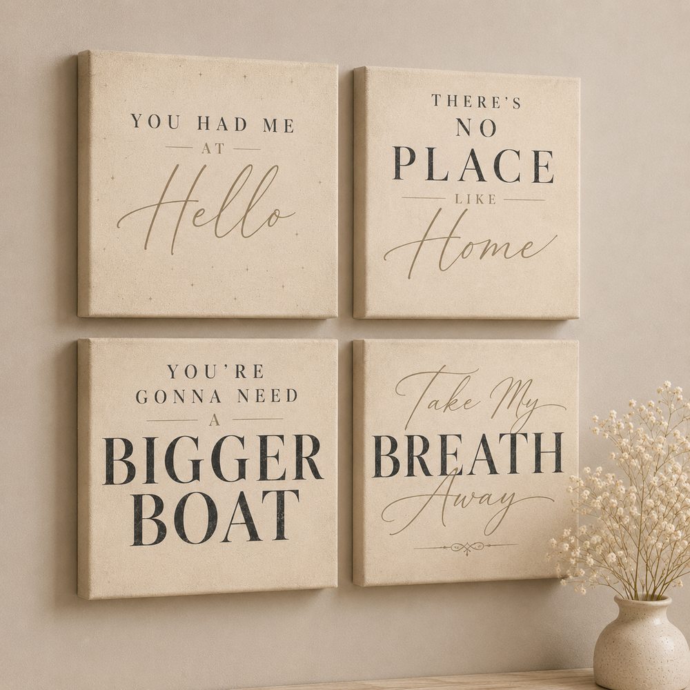 Four Movie Quotes canvas tiles on a warm neutral wall &mdash; You Had Me at Hello, No Place Like Home, Bigger Boat and Take My Breath Away